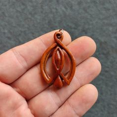 "This unique pendant is hand caved out of beautiful colored plum wood.This handmade wooden necklace is one of a kind and is a perfect daily accessory and suitable for special occasions. This wooden pendant is a special gift for him and her.It comes with Korean waxed cord and has lobster clasp at the end. You can chose between several options on how long you want the necklace to be -18\", 20\", 24\", and 30\"  inches . For custom necklace lengths send me a message. If you have any questions about Handmade Wooden Jewelry For Meditation, Unique Natural Wood Pendant Jewelry, Unique Handmade Natural Wood Jewelry, Nature-inspired Wooden Pendant Jewelry, Earthy Wooden Jewelry Gift, Earthy Wood Jewelry Gift, Earthy Wood Jewelry As Gift, Earthy Natural Wood Jewelry For Gifts, Special Gifts For Him