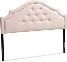 an upholstered headboard with black legs and buttons on the back of it