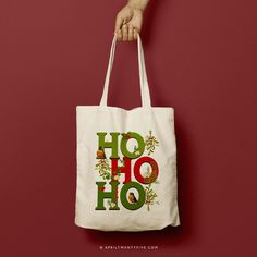 a person holding a white bag with the words ho hoo on it