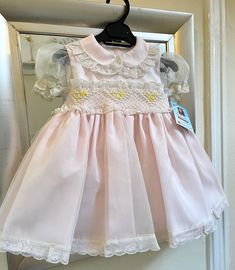 Stunning pink, cream and lemon smocked dress handmade in Spain by Sonata. In-stock now for immediate delivery. Age 2yrs - 8yrs. Canada House, Heirloom Dresses, Baby Knitwear, Hand Smock, Dress Handmade, Boys Set, Smocked Dress, British Indian, Exclusive Collection