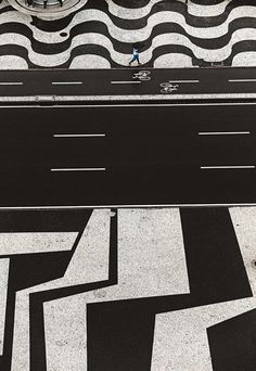 an overhead view of a street with black and white lines