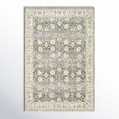 a gray and white rug with an ornate design