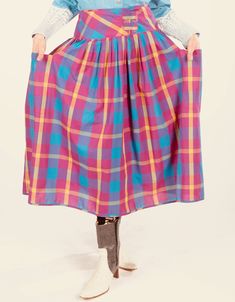 "80's Plaid Skirt/ Plaid Cotton Skirt/ Full Plaid Skirt/ Madras Skirt/ Summer Plaid Skirt/ Long Plaid Skirt/ Plaid Prairie Skirt Darling cotton skirt by Santa Cruz, San Francisco, Ca. Velcro waist attachment. Large side pockets. Soft light cotton. Original size tag reads size 7. Model is 5'4\" and a size 4 for scale. Please see exact measurements below.  Item measured while flat, double where applicable, i.e. waist, hips. Waist 14\" Hips 24\" Skirt length 30\" 100% cotton. Made in Taiwan. Denim blouse also available at https://www.etsy.com/listing/1422139842/banjo-dallas-texas-southwest-lace-blouse?" Retro Flared Skirt With Pockets, Fall Multicolor Skirt With Elastic Waistband, Multicolor Skirt With Elastic Waistband For Fall, Retro Multicolor Relaxed Skirt, Plaid Skirt With Pockets, Retro Relaxed Lined Skirt, Retro Cotton Skirt With Elastic Waistband, Retro Flowy Lined Skirt Bottoms, Retro Long Lined Skirt