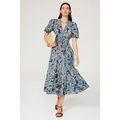 Blue floral cotton blend (70% Cotton, 30% Viscose). A-line. Short sleeves. V-neck. Pull on. 48" from shoulder to hemline. Imported. Floral Print Sundress V-neck For Day Out, Fall V-neck Sundress Midi Dress, Elegant Blue Floral Print V-neck Dress, Summer Floral Print V-neck Dress For Daywear, Floral Print Sundress For Day Out, Bohemian Midi Dress With Surplice Neckline And Floral Print, Blue Floral Print Midi-length V-neck Dress, Blue Floral Print V-neck Midi Dress, Flowy Floral Print Knee-length V-neck Dress