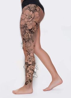 a woman's leg with flowers on it