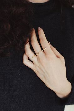 Subtle yet powerful, this ring is a favorite. An elegant yet easy piece for versatile wear, this ring is comfortable and delicate while remaining sturdy and bold looking. A hand shaped brass bar lays partly across three fingers wile a sterling band secures it in place. The ring looks great on its own or paired with stackers. The bar measures about 40 mm across.Choose a plain finish or stamped brass bar.This piece is made to order in your size, please allow 2-3 weeks to create before shipping (ti Everyday Brass Midi Rings, Modern Brass Midi Rings, Everyday Brass Midi Rings With Open Design, Brass Midi Rings For Everyday, Everyday Brass Open Midi Rings, Everyday Brass Midi Open Rings, Modern Adjustable Brass Midi Rings, Adjustable Modern Brass Midi Rings, Minimalist Everyday Stackable Brass Rings