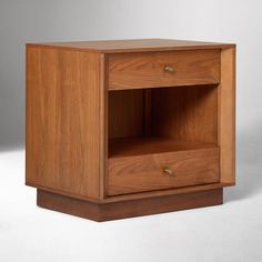 a wooden cabinet with two drawers on one side and an open drawer on the other