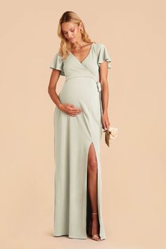 a pregnant woman in a green dress