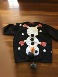 Men's black funny Christmas sweater. Funny Christmas sweater.  Snowman on the front. 'Tickles my baubles' on the back The design and work is all done by me. Measurements  Fits AU XL Chest 126cm  49.5 inches Sleeves 50cm 19.5 inches Length from shoulder to hem 68 cm  27 inches Fits size XL Please check the measurements against your own sweaters for the best fit. I post worldwide except for Germany. Thank you for your understanding. International Orders: import duties, taxes and charges are not in Black Long Sleeve Christmas Sweatshirt, Casual Black Christmas Sweater, Fun Long Sleeve Winter Sweater, Funny Cotton Winter Sweatshirt, Christmas Black Crew Neck Sweater, Funny Cotton Sweatshirt For Winter, Fun Winter Crew Neck Sweatshirt, Funny Black Winter Sweatshirt, Casual Black Christmas Sweatshirt