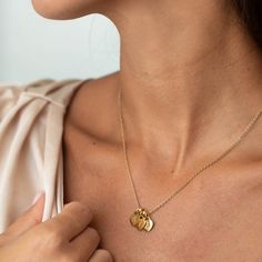 Introducing our exquisite Personalized Gold Stainless Steel Heart Necklace for Mom! This one-of-a-kind necklace allows you to customize it with your kids' names, making it the perfect meaningful gift. Crafted with love and attention to detail, the necklace features a stunning gold stainless steel heart pendant. The best part? You can add up to 7 hearts, ensuring all your precious little ones are represented close to Mom's heart. Stylish and sentimental, this necklace is a timeless reminder of th Mother's Day Gift Name Necklace With Charms, Charms Name Necklace For Mother's Day Gift, Charm Name Necklace For Mother's Day Gift, Customizable Heart Charm Necklaces, Heart Pendant Charm Necklace For Birthday And Mother's Day, Customizable Heart Charm Necklace For Birthday, Mother's Day Pendant Name Necklace With Charms, Mother's Day Name Necklace With Charms, Mother's Day Anniversary Name Necklace With Charms