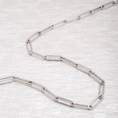 Your go-to basic chain necklace for that everyday wear. This Paperclip Chain Necklace can be worn with the toggle clasp in the back or in the front. The 2" extension allows you to wear this necklace as a choker or as a regular-length necklace. Wear this on its own or layer it with other Miki & Jane necklaces and pendants. Designed in New York. Ethically sourced materials. This is a Sterling Silver piece with Rhodium plating. Avoid contact with hairspray, perfume, hand sanitizer, and lotion. Avoi Classic Toggle Necklace With Oval Link Cable Chain, Classic Toggle Necklace With Rectangular Links And Cable Chain, Minimalist Jewelry With Chunky Paperclip Chain, Minimalist Toggle Necklace With Chunky Chain For Everyday, Everyday Toggle Necklace With Chain, Minimalist Chunky Paperclip Chain Jewelry, Elegant Toggle Link Necklace For Everyday, Minimalist Everyday Toggle Necklace With Chunky Chain, Elegant Everyday Toggle Link Necklace