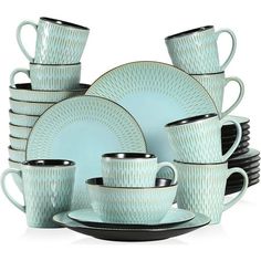 a stack of tea cups and saucers sitting next to each other on a plate