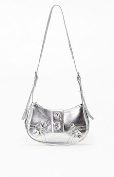 Shine bright with the Metallic Small Shoulder Bag from PacSun. Featuring a sleek metallic exterior, this chic bag comes with an adjustable double buckle shoulder strap, keyring and metal stud accents, and a secure zipper closure, making it the perfect accessory for adding a touch of glam to any outfit. Metallic exteriorZipper closureKeyring and metal stud accentsAdjustable double buckle shoulder strap PacSun Womens Metallic Small Shoulder Bag - Silver Trendy Silver Bag With Metal Hardware, Silver Leather Shoulder Bag With Hardware, Silver Shoulder Bag With Hardware For Everyday Use, Modern Silver Shoulder Bag With Branded Hardware, Silver Crossbody Shoulder Bag With Branded Hardware, Modern Metallic Bag With Metal Hardware, Trendy Metallic Bags With Silver-tone Hardware, Silver Shoulder Bag With Metal Hardware For Travel, Modern Silver Shoulder Bag With Gunmetal Hardware