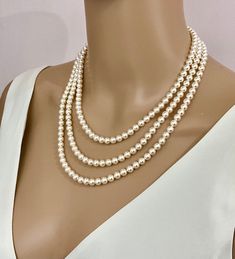 triple strand layered pearl necklace, classic and timeless elegance. Finished in sterling silver, rose gold or yellow gold with famous branded named crystal core pearls made to measure for you. with a Choice to add a pearl drop on the bottom strand or to leave plain. As this is custom made for you, You may choose the best length of the pearls to suit you and choose the pearl colours. The necklace does have a vintage classic inspiration and, as it is finished in sterling silver, it will be a piec Elegant Multi-strand Pearl Necklace With Charm, Elegant Double Strand Necklace For Anniversary, Classic Double Strand Pearl White Necklace, Elegant Double Strand Pearl Necklace With Charm, Classic Multi-strand Pearl Necklace, Elegant Double Strand Silver Pearl Necklace, Elegant Silver Double Strand Pearl Necklace, Classic Silver Multi-strand Necklace, Classic Pearl White Multi-strand Necklaces