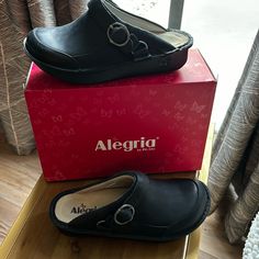 Never Worn Alegria Seville Size 38 Fits Women’s Size 7.5 To 8. Removable Footbed. Black Oiled Leather Upper. Very Comfortable. Also Have Size 39 Which Is Woman’s Size 8.5 Black Synthetic Clogs With Buckle Closure, Black Leather Footbed Clogs, Black Clogs With Buckle Closure For Workwear, Black Workwear Clogs With Buckle Closure, Black Leather Clogs With Buckle Closure, Black Leather Lined Slip-on Clogs, Black Leather-lined Slip-on Clogs, Slingback Black Clogs With Buckle Closure, Black Slingback Clogs With Buckle Closure