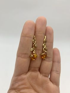 Gold Amber Earrings set with Natural Amber in a top grade & brownish-yellow translucent resin, at 10x8mm each (6 Ct a pair).Gold Vermeil: 18k Gold over Solid 925 Sterling Silver ☞ made to last.Click here for ☞ Matching RingClick here for ☞ Matching PendantDetails:• Natural Amber in a top grade & a stunning honey color• Amber: 10x8mm, 6 Ct a pair, cabochon cut• Lever Back Closure - "English Lock"• Dimensions: Length 30mm, Width 10mm• 18k Gold Vermeil❀ Each Natural Gem is unique & will have Slight Formal Amber Citrine Earrings, Elegant Single Amber Earring, Yellow Elegant Pierced Earrings, Elegant Yellow Pierced Earrings, Elegant Yellow Baltic Amber Jewelry, Amber Citrine Teardrop Earrings, Amber Citrine Dangle Earrings, Amber Citrine Earrings With Ear Wire, Orange Pierced Earrings For Formal Occasions