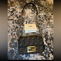 Fendi Bag In Great Used Condition Bag Comes With Box, Dust Bag, Receipt, Bag Has Slightly Wear Signs, Bag Hardware Has Normal Wear Like Any Other Pre Owned Bag!! Feel Free To Request More Pictures. Https://Www.Fendi.Com/Us-En/Woman/Bags/Mini-Bags/Baguette-Mini-Brown-Ff-Jacquard-Fabric-Bag-8bs017a6v5f17u4?Gad_source=1&Gclid=Eaiaiqobchmil_dh8mcbhwmvyyotbh0ilw8eeaqyayabegiyupd_bwe&Gclsrc=Aw.Ds Fendi Baguette Mini, Bag Hardware, Fendi Bag, Fendi Baguette, Fabric Bag, Bags Mini, Jacquard Fabric, Fendi Bags, Mini Bags