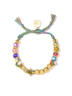 This Be Nice Bracelet is more than just a fashion statement - it's an attitude adjustment! Bright rainbow tie dye threadwork and glass charms shimmer in the light, while pave rhinestone accents and ceramic charms add a bit of extra shine. Make every day a little brighter in style! 6" Adjustable rainbow threadwork Drawstring closure (extendable up to 8") Gold plated brass hardware Glass charms Pave rhinestone charms Ceramic charms Handmade in New York City and Puerto Rico. Due to the handmade nat Ceramic Charms, Attitude Adjustment, Rainbow Tie Dye, Rainbow Tie, Bright Rainbow, Daith Piercing, Glass Charms, Arm Party, Be Nice