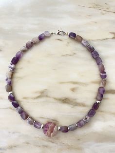 A necklace made of natural stone suitable for holidays and everyday wear, for office and concert, a gift for mom, sister, or a friend for their birthday, wedding day, Christmas, or Valentine's Day. A personalized meaningful gift based on the zodiac sign and moon phase. A Fluorite charm, 0.88 ounces in size, supports fluorite 6mm beads and hematite inlays. Steel hardware, lobster clasp. Lithotherapy. Lavender Necklaces With Natural Stones For Gift, Adjustable Single Strand Crystal Necklace For Healing, Purple Natural Stones Necklace For Meditation, Adjustable Lavender Single Strand Necklace, Purple Single Strand Beaded Necklace Gift, Purple Single Strand Beaded Necklace For Gift, Spiritual Single Strand Purple Beaded Necklace, Lavender Gemstone Beaded Necklace For Gift, Gift Purple Single Strand Beaded Necklace