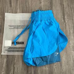 New Gymshark 2-In-1 Running Shorts. Size Xs Blue Athletic Shorts For Gym And Summer, Light Blue Sports Shorts For Summer, Blue Sporty Athletic Shorts For Beach Season, Blue Sporty Shorts For Beach Season, Blue Sporty Shorts For Summer, Sporty Light Blue Shorts For Beach, Sporty Blue Bottoms For Beach Season, Sporty Blue Shorts For Beach Season, Light Blue Moisture-wicking Bottoms For Summer