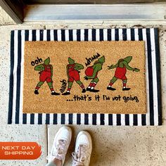 a door mat with three ninjas on it next to a pair of white shoes