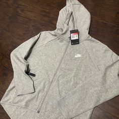 Size Small Brand New Grey Nsw Tech Hoodie Casual Moisture-wicking Fleece Hoodie, Casual Long Sleeve Hooded Jacket For Gym, Nike Sporty Hoodie For Spring, Nike Sporty Sweatshirt For Workout, Nike Sporty Spring Hoodie, Athletic Heather Hooded Hoodie For Sportswear, Athletic Heather Hooded Hoodie Sportswear, Sporty Nike Sweatshirt For Workout, Athletic Heather Hooded Sportswear Hoodie