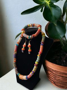 Make a Bold and Beautiful Statement with any variation of the Krobo!  Krobo beads are handmade with finely ground  recycled glass that is baked, molded and then  hand painted. Set includes:  Necklace                           Bracelet                           Earrings  Handmade in Ghana with love ❤️ Krobo Beads, Recycled Gifts, Tootsie Roll, Bold And Beautiful, Recycled Glass, Necklace Bracelet, Chain Styles, Artisan Jewelry, Ghana