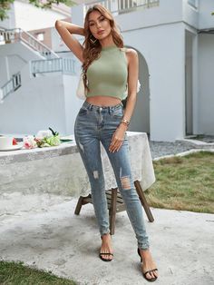 Our Zavier Top comes in a sage green tone. This ribbed, high neckline, sleeveless crop top is the perfect transitional piece! Pair with your favourite denim jeans for an effortless look going into the warm weather! Size Guide: Susan is 5’2” tall, and has a 33.2” bust, 24.5”waist, & 36.7” hips. She is wearing a S / US 4 / AU 8. This crop top is true to size. Feature: Relaxed fit. Lightweight. Unlined. High neck. Stretchable fabric. Material: 70% Viscose, 30% Polyester. Care Instructions: Machine Trendy Boots, Green Tone, Selling Clothes, Sleeveless Crop Top, Daily Dress, Knit Crop Top, Knit Crop, Knit Jumper, High Neckline