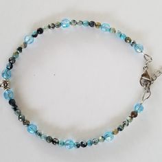 This Post Is For A Handcrafted Anklet (Ankle Bracelet). It Can Be Worn As A Wrist Bracelet. It Is 10 With An Extender Chain To Make It Bigger. It Is Made Of 4mm Gemstones And 6mm Crystals. All Of The Beads Are Shades Of Blue. The Sun Charm Is Stainless Steel. The Lobster Clasp And 2" Extender Are Stainless Steel. This Is A Great Accessory For All Occasions And Seasons. The Healing Colors Also Lean Towards Mermaid Core, Beach Vibes And Even A Cruise. Plus Size Dainty Charm Bracelet Or Average Siz Adjustable Blue Crystal Bracelet With Lobster Clasp, Blue Crystal Bracelet With Lobster Clasp And Adjustable Fit, Healing Colors, Gemstones And Crystals, Multicolor Bracelet, Mermaid Core, Sun Charm, Blue Beaded Bracelets, Wrist Bracelet