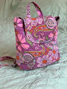 "Psychedelic Paisley Vintage Backpack with adjustable straps!! Super groovy!  Excellent vintage condition  Medium in size measurements: Length:12\"  Width: 10\"" Multicolor Everyday Bags With Adjustable Straps, Everyday Multicolor Bag With Adjustable Straps, Everyday Multicolor Bags With Adjustable Straps, Multicolor Shoulder Bag With Adjustable Straps For Daily Use, Daily Use Multicolor Shoulder Bag With Adjustable Straps, Multicolor Softback Bag With Adjustable Strap, Adjustable Multicolor Bags With Removable Pouch, Multicolor Backpack With Adjustable Straps, Purple Softback Bag With Adjustable Strap