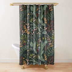 a shower curtain with green leaves and berries on it, hanging from a gold rod