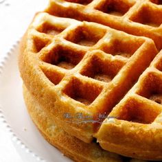 two waffles on a white plate with the words, the great misshapen