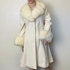 "Womens M by Ruby Martin Originals 100% wool 40\" bust 38\" waist 52\" hips 41\" length 17\" across shoulders 23\" sleeve This coat is just unreal. A pure milk white 1960s wool fitted trench coat with giant fluffy wool cuffs and collar. Closes with oversize white celluloid buttons down the front and has pockets at the waist. There are a few tiny moth bites and slight tearing inside the inner lining, but overall this coat is in phenomenal condition for its age." Fluffy Trench Coat, Fitted Trench Coat, Penny Lane Coat, 1960s Dresses, Tie Waist Top, Mink Coat, Plus Size Two Piece, Penny Lane, White Coat