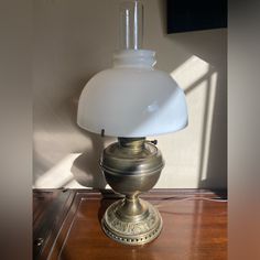 a lamp sitting on top of a wooden table