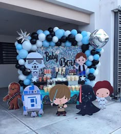 star wars themed birthday party with balloon decorations and balloons on the side of the building