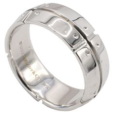 Tiffany & Co. Streamerica 18 Karat White Gold Band Ring Metal: 18k white gold Weight: 12.4 grams Width: 8mm Size: 10.5 (US) Signed: ©2002 Tiffany & Co. 750