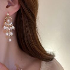 ✦ Elevate your elegance with our classy chandelier earrings, showcasing a timeless freshwater pearl design that exudes sophistication. Crafted for those special moments, these earrings are the epitome of refinement, making them an ideal choice for weddings and engagements. The chandelier style adds a touch of grandeur, ensuring you shine on your special day. The lustrous freshwater pearls create a classic and enduring accessory that complements bridal ensembles with grace. Let these earrings be Elegant Drop Pearl Earrings With Dangling Beads, Elegant Jewelry With Dangling Beads, Elegant Pearl Charm Chandelier Dangle Earrings, Elegant Pearl Charm Chandelier Earrings, Elegant Dangling Bead Pearl Earrings For Party, Elegant Dangling Pearl Earrings For Party, Elegant Pearl White Chandelier Earrings With Pearl Drop, Elegant Formal Chandelier Earrings With Dangling Beads, Pearl Dangle Chandelier Earrings With Pearl Charm