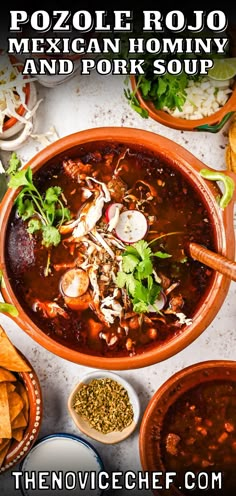 a bowl of mexican soup with tortilla chips and cilantro on the side