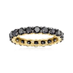 a black and white diamond ring in yellow gold tone, set with two rows of diamonds