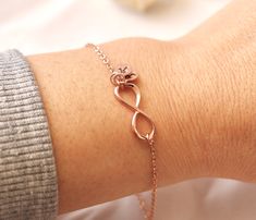 Infinity symbol represents continuous connection, eternity and everlasting love. Personalize this rose gold infinity bracelet by adding the initials of loved one.   Silver infinity bracelet:  https://www.etsy.com/ca/listing/197354727/sterling-silver-infinity-bracelet?click_key=95139ec8199a44b7fdc5032d6bdb60da6c91e12d%3A197354727&click_sum=66eaad64&ref=shop_home_active_2 Gold infinity bracelet:  https://www.etsy.com/ca/listing/169176101/infinity-bracelet-with-personalized?click_key=45721134b7943d Rose Gold Infinity Bracelets For Friendship, Infinity Rose Gold Bracelet For Mother's Day, Rose Gold Infinity Bracelet For Mother's Day, Personalized Infinity Rose Gold Jewelry, Personalized Rose Gold Infinity Jewelry, Dainty Rose Gold Infinity Jewelry, Elegant Infinity Bracelet For Best Friend, Rose Gold Infinity Bracelet Gift, Rose Gold Bracelet For Mother's Day Best Friend Gift