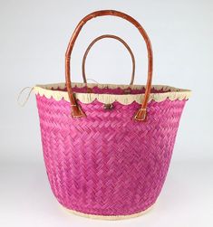 These beautiful pieces are designed in South Africa. Handmade with raffia and featuring leather handles, these bags bring the perfect mix of bohemian chic to everyday wear! Capable of being used as a handbag, basket or storage-this multi-purpose piece is a cannot miss! The double closure top provides a multi-style capability as well! Sizing: 16 inches wide x 12 inches deep x 13 inches high Bohemian Handbags, Elephant Keychain, Top Handle Bags, Bead Bangles, Fashion Victim, Leather Gifts, Leather Handles, Bohemian Chic, Leather Handle