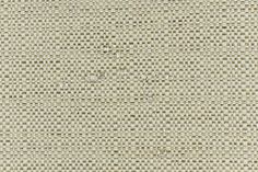 an upholstered fabric with small dots in beige and brown colors on the surface