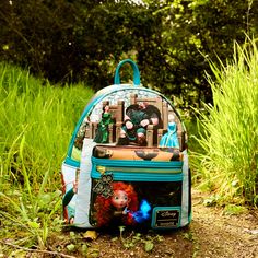 Take fate into your own hands. The Loungefly Brave Merida Princess Scene Mini Backpack features unique scenes from Disney-Pixar’s animated feature displayed across each panel of the bag. Turn the backpack around and you will find inspiring moments from Merida’s journey, including her meeting with a will-o’-the-whisp and transformative events with her family. An enamel zipper charm of Merida’s brothers in bear form completes the scene. This spellbound accessory will keep your belongings safe on a Themed Travel Backpack, Themed Character Print Bags For Disney Trips, Themed Bags With Character Print For Disney Trips, Themed Backpack For Theme Park, Themed Standard Backpack For Theme Park, Green Disney Travel Backpack, Green Disney Backpack For Travel, Green Backpack For Disney Trips, Disney Green Travel Backpack