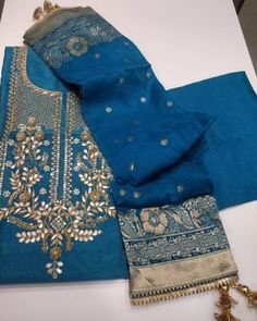 Item Overview ATHARVA Hand Embroidered Salwar Kameez inNavy Blue w/Embroidered Neck/Banarsi Silk Dupatta/Gota Patti/Custom Stitching/Wedding/Latkans/CH Dno. CH Fabric: * Shirt: Chanderi Silk - Navy Blue - 2.5 Mts, with Beautiful Embroidery Neck * Dupatta: Banarsi Silk Dupatta. (Motifs may wary) * Salwar: Santoon Silk - 2.5 Mts. Excusive Hand Embroidered Party Wear Punjabi Suit. Customization: * Fabrics: Designs Can be made in different Fabrics. * Stitching Available Care: * Dry Clean/ Avoid dire Traditional Wear With Intricate Embroidery In Shantoon, Traditional Wear With Intricate Embroidery And Shantoon Drape, Traditional Wear With Intricate Embroidery And Traditional Drape, Traditional Drape With Intricate Embroidery In Shantoon, Semi-stitched Katan Silk Traditional Wear With Intricate Embroidery, Blue Semi-stitched Churidar With Resham Embroidery, Bollywood Style Churidar With Intricate Embroidery, Traditional Designer Shantoon Lehenga, Traditional Designer Lehenga In Shantoon