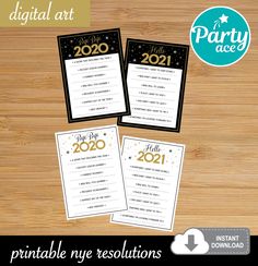 two black and gold new year's eve party game cards on a wooden table