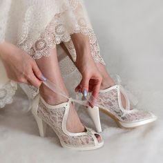 "Add romance and grace on your wedding look with our floral tulle bridal boots; a perfect fusion of vintage beauty and fairytale charm.  These wedding shoes are crafted from exquisite sheer lace material, designed with lace-up ties, giving them a sense of timelessness and class. The elegant peep toe design is accentuated with a cute rhinestone brooch on the front, offering a dash of sparkle on your special day.  Padded insoles and platforms on the front promise to keep your feet comfortable dancing the night away. Each pair of these enchanting bridal shoes is created with love and care, paying attention to every detail.  Ivory sheer lace wedding shoes for bride, custom heel heights available. These luxurious heels would make a bride-to-be happy as a custom wedding gift.  They are made of s Vintage White Heels For Wedding, Elegant Tulle Heels For Wedding, Elegant Tulle Wedding Heels, Elegant Wedding Shoes With White Laces, Vintage Wedding Shoes With Almond Toe, Elegant Cream Wedding Shoes With White Laces, Vintage High Heel Wedding Shoes, Sleeping Beauty Wedding, Whimsical Shoes