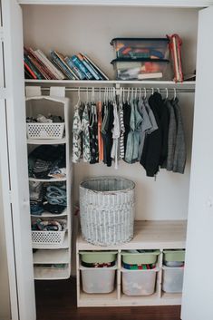 an organized closet with clothes and baskets