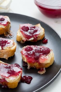 four pieces of bread with jam on them