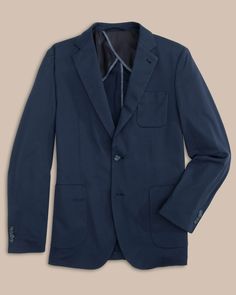 This blazer will instantly be your go-to formal coat. Lightweight and relaxed, you’ll feel polished yet comfortable all day long. Pair our navy men's blazer or khaki blazer with our Jack Pant for an elevated look. You can also pair with our Charleston Denim to provide added sophistication to a casual go-to. Fight the southern heat with built-in Coolpass technology and reduced lining for optimal breathability. Style: 7242 Navy Business Outerwear With Patch Pockets, Navy Sport Coat With Patch Pockets For Work, Navy Classic Sport Coat With Patch Pockets, Navy Sport Coat With Suit Collar For Work, Navy Sport Coat For Workwear, Solid Sport Coat With Pockets For Business Casual, Navy Single Button Fall Blazer, Navy Single Button Blazer For Fall, Navy Single-button Blazer For Fall