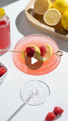 a glass filled with raspberry lemonade and garnish